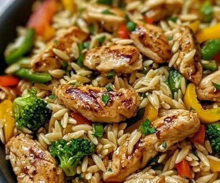 Lemon Chicken & Veggie Orzo Stir Fry with fresh vegetables and herbs