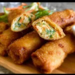 Crispy Crab Rangoon Egg Rolls served with dipping sauce