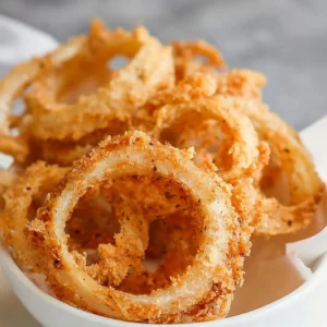 Crispy fried onion rings served on a plate