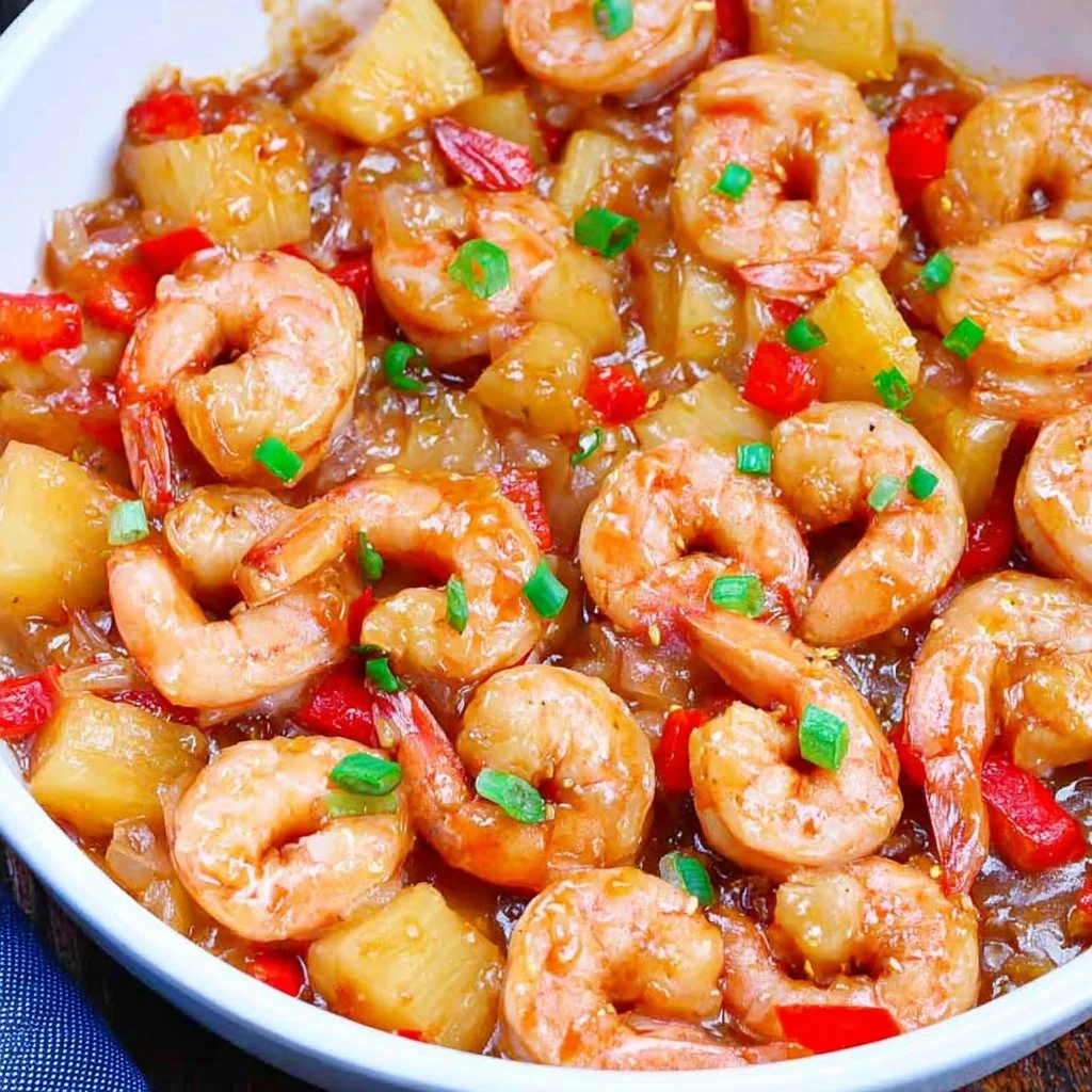 Delicious Pineapple Shrimp dish served with fresh vegetables and herbs