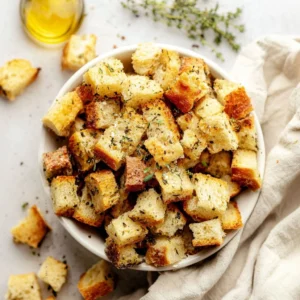 Delicious homemade croutons made from sourdough bread, perfect for salads.