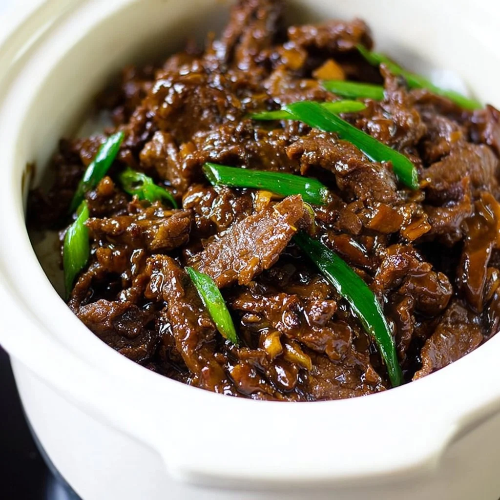 Bowl of Slow Cooker Mongolian Beef with rice and vegetables
