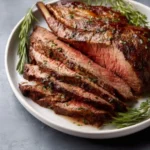 Barefoot Contessa's delicious roast beef recipe served on a platter