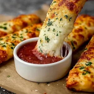 Cheesy breadsticks served fresh from the oven with melted cheese