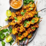 Delicious homemade chicken satay served with peanut sauce