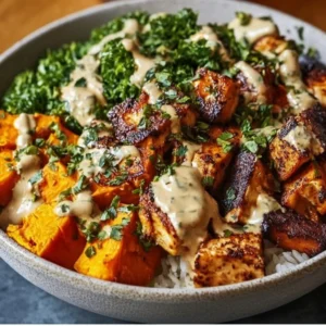 Healthy chicken and sweet potato bowls featuring vibrant veggies and spices.