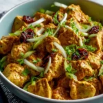 Delicious Ina Garten chicken salad curry recipe served in a bowl with vibrant ingredients.
