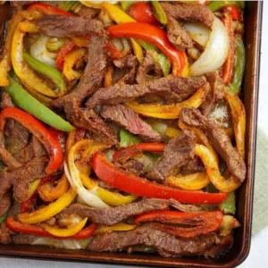 Sheet pan steak fajitas with colorful peppers and onions ready to serve