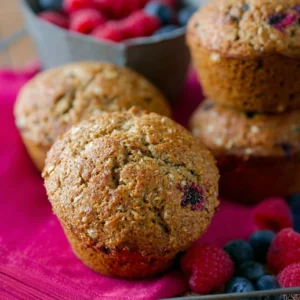 Freshly baked whole wheat bran muffins on a wooden table