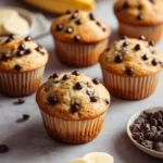 Freshly baked Banana Chocolate Chip Muffins on a cooling rack