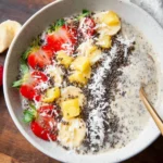 Banana Split Smoothie Bowl topped with banana slices and nuts for a healthy treat