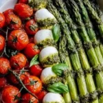 Delicious Caprese Roasted Asparagus dish with tomatoes and mozzarella