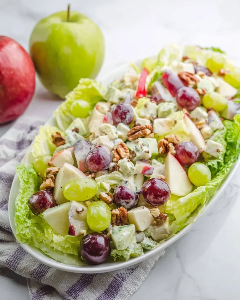 A fresh Classic Waldorf Salad featuring apples, walnuts, and grapes for a healthy meal.