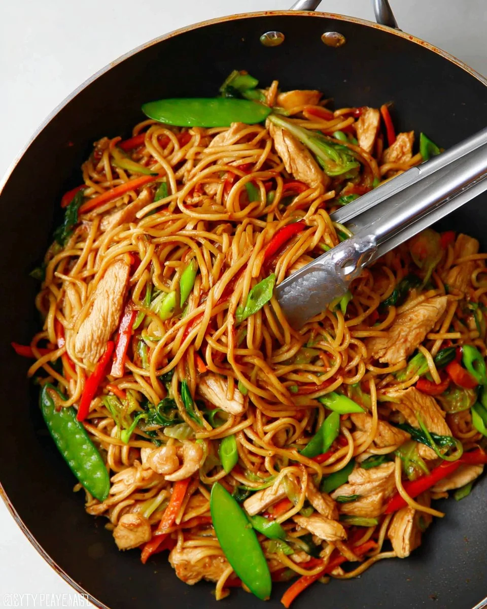 Bowl of easy chicken lo mein with colorful vegetables and noodles