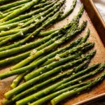 Delicious garlic butter roasted asparagus served on a plate