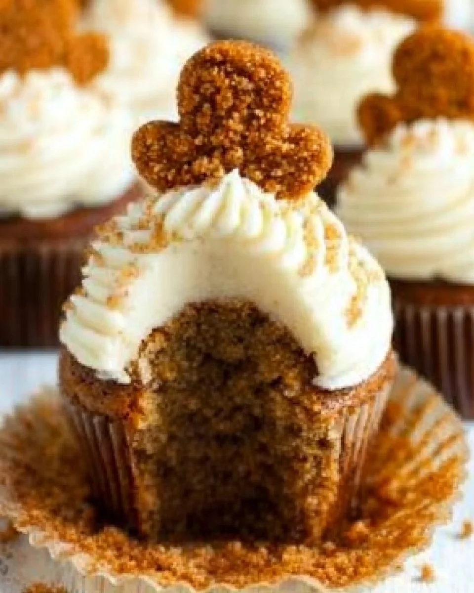 Deliciously decorated gingerbread cupcakes with frosting on a festive table