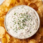 Healthy Greek yogurt onion dip served in a bowl with fresh vegetables