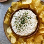 Homemade sour cream and onion dip served with fresh veggies and crackers