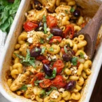 Baked Mediterranean Chicken with feta cheese and vegetables in a casserole dish