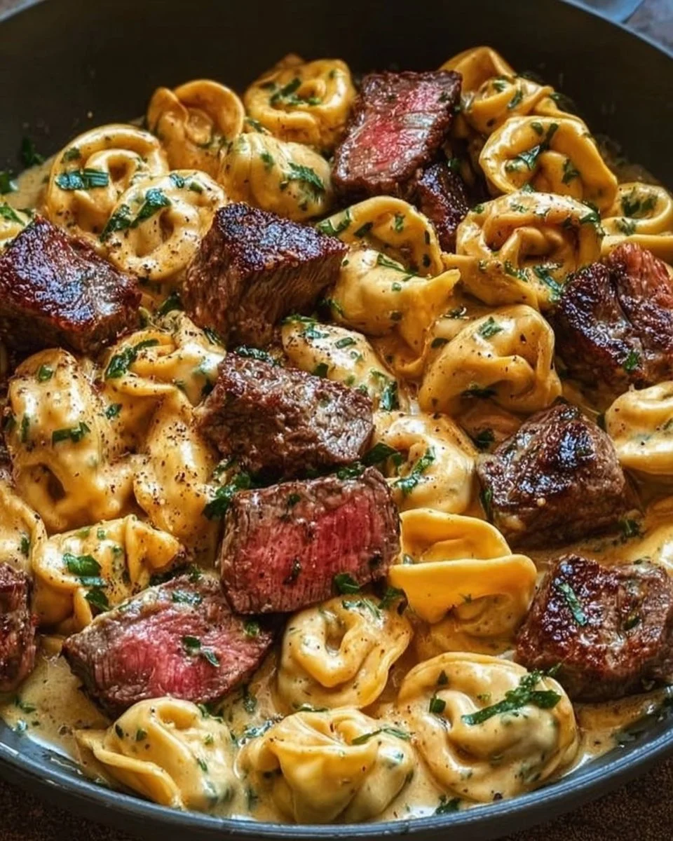 One-pan cowboy butter tortellini with steak bites on a rustic table