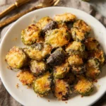 Baked Parmesan Smashed Brussels Sprouts topped with cheese