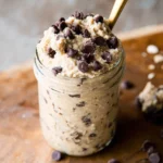 Delicious protein cookie dough topped with chocolate chips in a bowl
