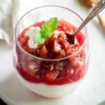 Delicious rhubarb compote served in a bowl with fresh rhubarb stalks