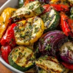 Plate of roasted Mediterranean Greek vegetables with vibrant colors and textures