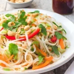 Colorful Spring Roll Salad with Spicy Ginger Dressing on a plate