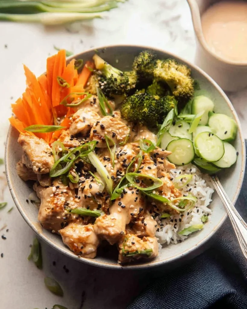 Yum Yum Chicken Bowls with fresh vegetables and savory toppings