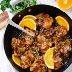 Delicious Asian Glazed Orange Chicken served with steamed rice and vegetables