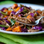 Delicious BBQ brisket hash with potatoes, peppers, and onions on a plate