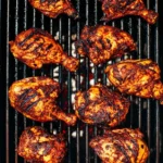 Delicious BBQ chicken grilled to perfection on a barbecue.
