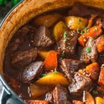 Bowl of heart-healthy classic beef stew with vegetables and herbs