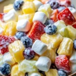 Delicious creamy fruit salad in a bowl, perfect for busy families.