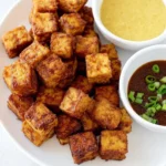 Crispy baked tofu served with vegetables in a bowl