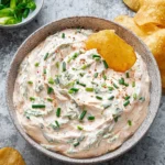 Delicious cream cheese dip served with crackers and vegetables