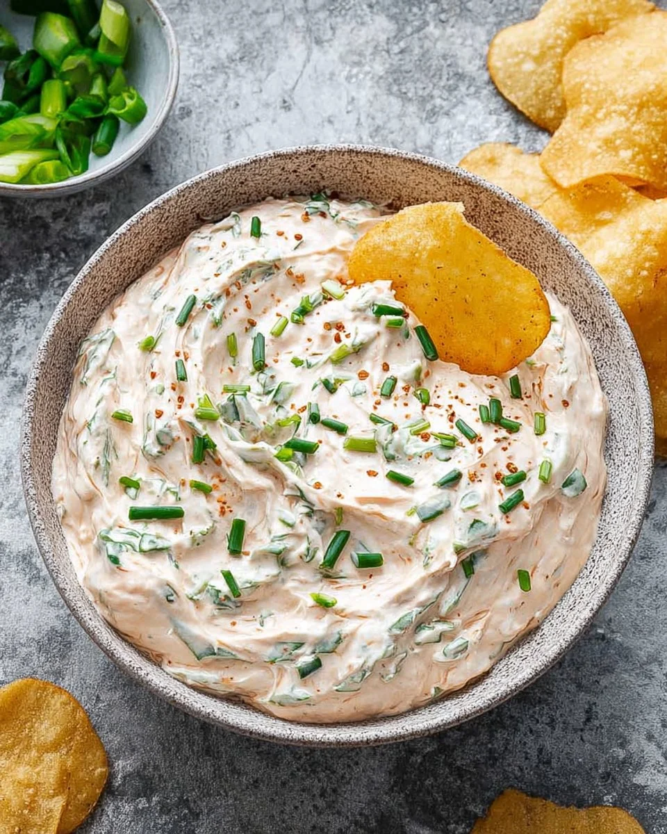 Delicious cream cheese dip served with crackers and vegetables