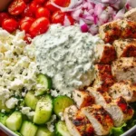 Delicious Greek Chicken Bowl with fresh vegetables and flavorful toppings