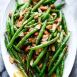 Green beans served with browned butter and almonds for a tasty side dish