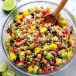 Healthy quinoa salad with fresh vegetables and dressing