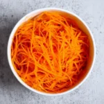 Korean Carrot Salad Morkovcha served in a bowl with spices