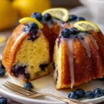 Delicious Lemon Blueberry Bundt Cake on a rustic wooden table