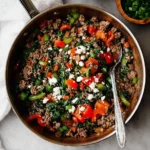 Mediterranean ground beef stir fry served in a colorful bowl with vegetables