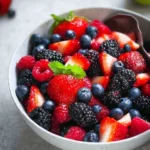 Delicious mixed berry fruit salad with strawberries, blueberries, and raspberries