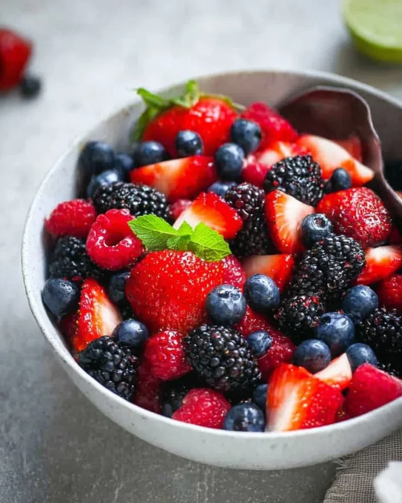 Delicious mixed berry fruit salad with strawberries, blueberries, and raspberries