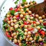 Fresh Mediterranean Chickpea Salad with herbs, vegetables, and dressing