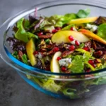 Fresh pear salad with mixed greens and vinaigrette dressing