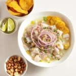 Fresh Peruvian Ceviche garnished with lime, cilantro, and chili pepper.