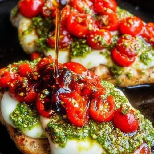 Delicious Pesto Bruschetta Chicken served with fresh ingredients on a plate